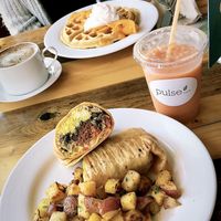 breakfast burrito and peach belgium waffles  at Pulse Cafe in Hadley