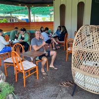 People on the lanai of IMUA Coffee Roasters. at Imua Coffee Roasters in Kapaa
