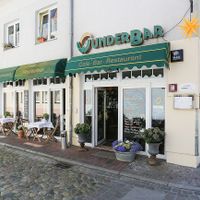 Main entrance and outdoor seating at WunderBar in Guestrow