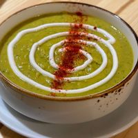 Vegan green curry soup with chickpeas and tahini sauce at Goroh in Omsk