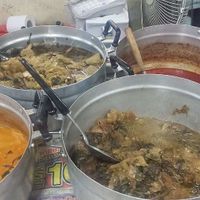 Pots of curries and stews at Warorot Market Food Stall in Chiang Mai
