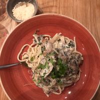 Cream and mushroom pasta with Parmesan  at Versachi Pizza and Wine Bar in South Yarra