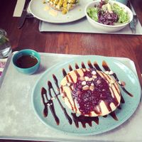 Berry pancakes and bagel with scrambled tofu  at Beetnut in Zurich