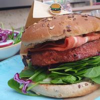 Vegan bacon burger and a side salad at Beetnut in Zurich
