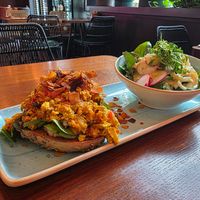 Bagel with tofu scramble and salad. at Beetnut in Zurich