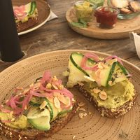 Hummus on rustic bread with courgette, onion and almonds. at Nude Cafe in Ibiza