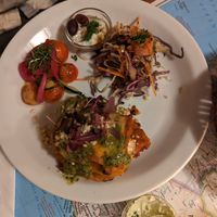 Lasagna with side salads at Atlas Bar in Copenhagen