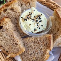 Bread with home made butter with herbs at Atlas Bar in Copenhagen