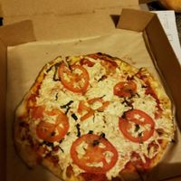 Delicious pizza with vegan cheese, basil, and tomatoes! It was amazing! at Your Pie in Peachtree City
