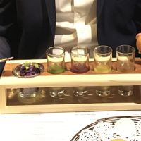 Purple potato stuffing with mint, pineapple, pomegranate, and tamarind sauce shots at Navadhanya in Cambridge