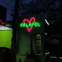 falafel neon sign outside the restaurant at FalafaLafa in Brooklyn
