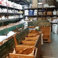 Back of the store full of different flours, grains, cocoa, chocolates  at Casa Perris in Barcelona