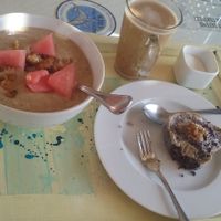 Banana smoothie bowl, almond latte and raw brownie. at Marine Garden Camp in Dahab