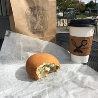 Pumpkin spice latte and Green onion & ";sausage"; Kolche at Mud Pie Vegan Bakery and Coffee in Mission