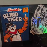 Stickers on napkin dispensers at The Bark in Tallahassee