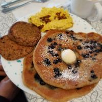 Blueberry pancakes, sausages, and tofu scramble. at Spiral Diner & Bakery in Denton