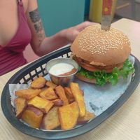 Chicken burger with sweet potato wedges and dip at Huacamole Vegan Food in San Pedro