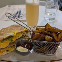 Crunchwrap Supreme, sweet potato fries, Ginger drink at Huacamole Vegan Food in San Pedro