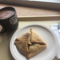 empanada de zanahoria y papas con un cacao caliente at Huacamole Vegan Food in San Pedro