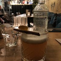 Seasonal cocktail: hot apple juice, cinnamon, rum and orange wedge at Mr. & Mrs. Watson in Amsterdam