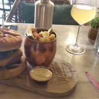 Delicious vegan bbq burger with fries and a kombucha drink. at Mr. & Mrs. Watson in Amsterdam