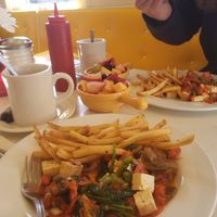 Delicious vegan tofu scramble with fries and fruit salad at Liz's Cafe Anybody's Bar in Provincetown