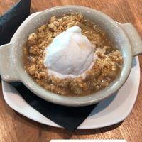Vegan apple crumble  at LHR - Giraffe - T5 in West London