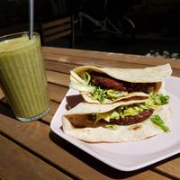 Sprouted lentil burger with the smoothie of the day (apple, banana, cinnamon, parsley) at Solar Kitchen Bar in Larnaca