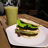 Spinach burger with the smoothie of the day (apple, banana, cinnamon, parsley) at Solar Kitchen Bar in Larnaca