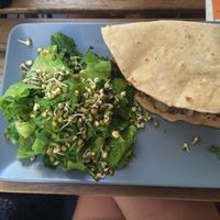 Burger with salad and sprouts at Solar Kitchen Bar in Larnaca
