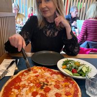Vegan American hot pizza and mixed side salad at Pizza Express in Salford