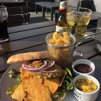 Vegan bean burger with tortilla chips, mango dip, barbecue sauce and fries. at Smeltehuset in Odda