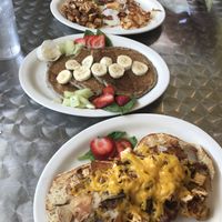 Too: classic tofu scramble with home fries, blueberry pancakes (butter NOT vegan so didn’t add), and bottom: Vegan melt with cheeze and home-fries on bagel.  at Stella's Cafe in Wildwood