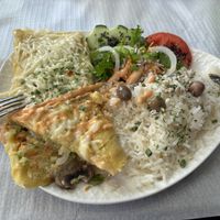 Mushroom ‘omelette’ with rice and salad  at Veggie Momi in Albufeira
