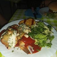 Wrap, topped with a delicious sauce, almonds and salad at Veggie Momi in Albufeira
