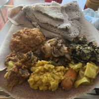 Veggie sampler, mushroom tibs, and shuro with teff injera  at Moya in San Francisco