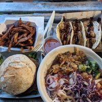 All vegan: tacos, fries, burger, and buddha bowl with udon. at The Burger Cafe in Tenerife