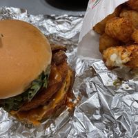 stacked chick’n burger with tater tots   at Next Level Burger - Roosevelt in Seattle