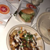The “AMERICAN BURGER”, The “MAVERICK CLUCKWICH”, The “CHILI CHZ STYLE FRIES”, The “CLUCKERWINGS” & a “COOKIES N' CREAM” shake  at Next Level Burger - Roosevelt in Seattle