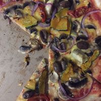 Vegetarian pizza with vegan cheese  at The Pizza Shop in Port Douglas