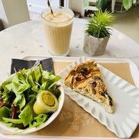Leek and courgette quiche with salad, Greek iced coffee.   at Barbarella Juicebar in Ljubljana