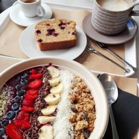 Açai bowl, melon and blueberry cake, espresso and chai latte soya at Barbarella Juicebar in Ljubljana