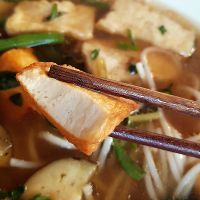 Bun mam Bac Lieu (vegan): Rice noodles with aubergine, bean sprouts, two types of tofu and herbs in Bac Lieu style at Miss Saigon in Berlin