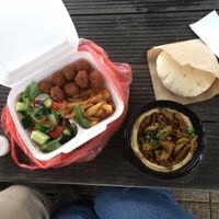 Vegan menu for two - salad, fries, falafels, homemade bread and hummus with shawarma on top. Delicious taste but small portion for two (i could eat this on my own easily).  at  Paprika in Prague