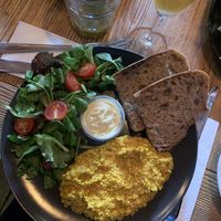 vegan tofu scrambled eggs with salad and bread (and a mimosa) 🌈  at Satsang in Prague