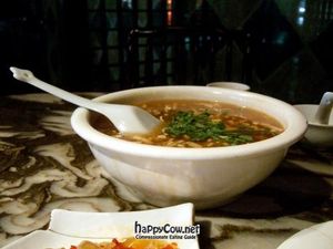 Hot and sour soup. This was huge, very cheap, and  and very tasty. Recommended. Foreground: pickles. at GōngDé Lín - Godly - Nanjing Rd in Shanghai