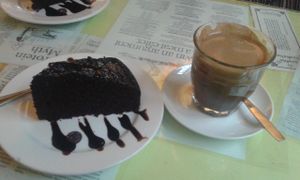 Vegan choc cake and dandelion drink at Bookworm Cafe in Outlying Islands