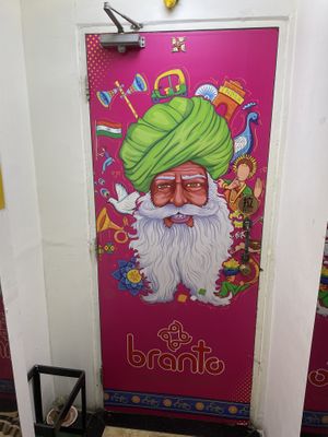 (3) Pull open the door to the restaurant   at Branto Pure Indian Vegetarian Club in Kowloon