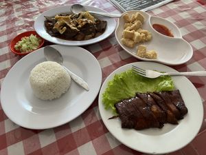 (From 12oclock) Pork belly, calamari, and roast duck  at Happy Buddha in Kuta