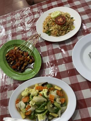 Fried rice, chicken satay & mixed vegetables  at Happy Buddha in Kuta